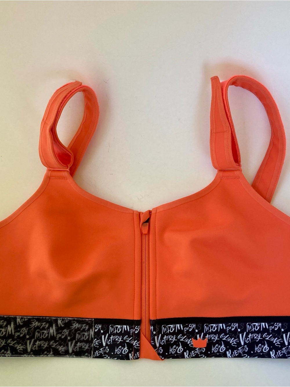 Front-Zip SheFit brand Orange Coral Sports Bra with Graphic Band